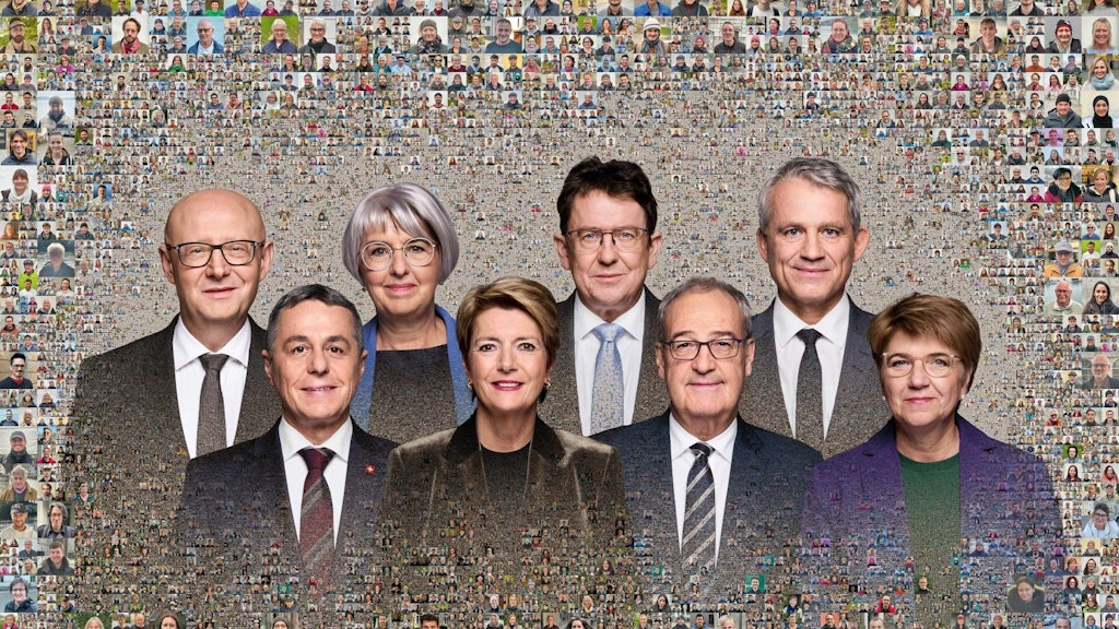 На фото Федерального совета изображены семь членов Федерального совета, а также федеральный канцлер.