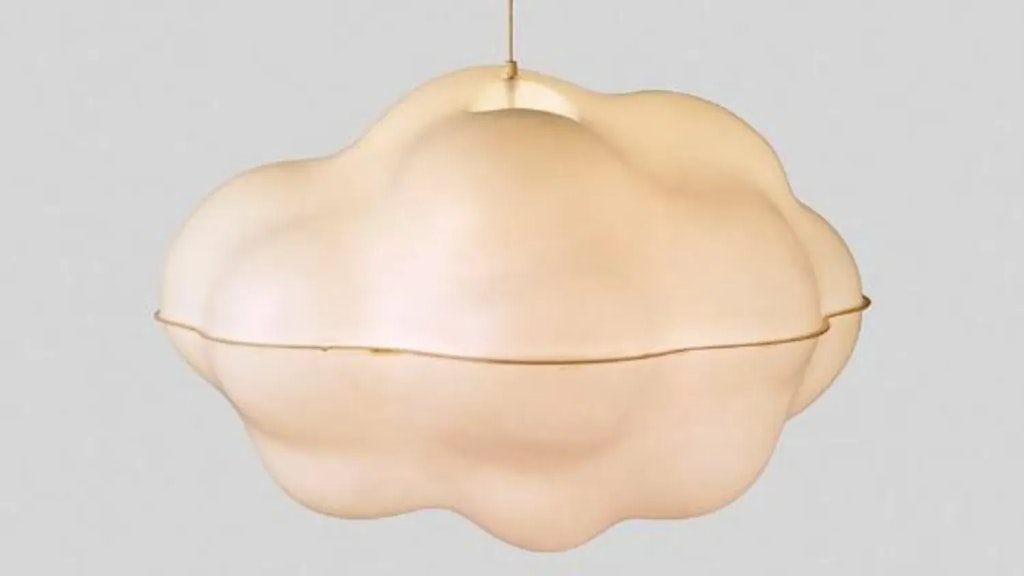 Pendant lamp shaped like a cloud, with a wavy surface and light finish, shown against a plain grey background.