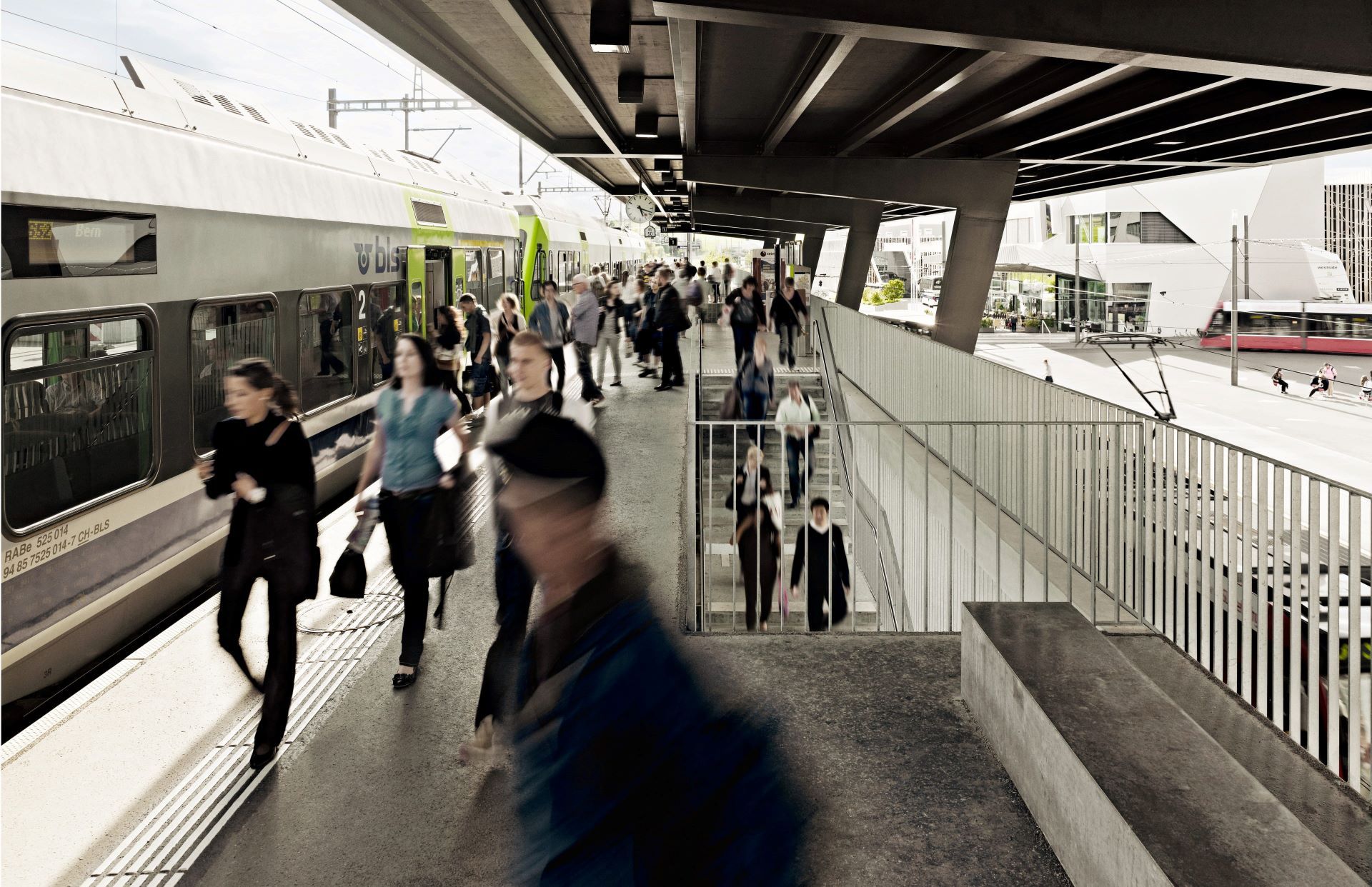 People walking across a hall