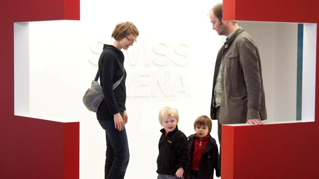 A family visiting an exhibition. 